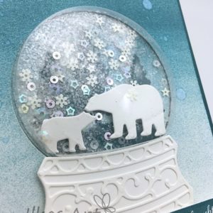 Karte mit Stanzform "Schneekugel"